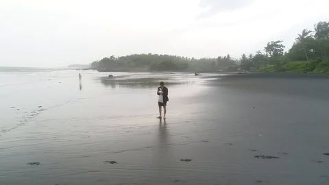 Footage recorded with drone of an adventurous guy taking a selfie Stock Footage 105669565