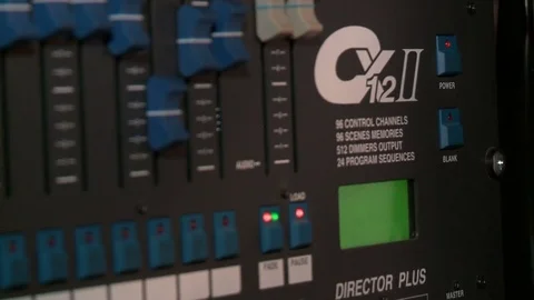Footage of a recording studios audio console and a hand pulling up the knobs Stock Footage 71360195