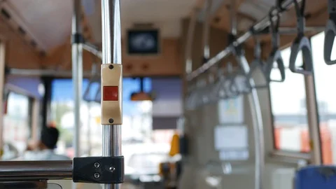 Footage of red stop button from inside bus, public transport. 4k Stock Footage 112912676