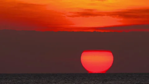 Footage of red sun setting over sea Stock Footage 332165886