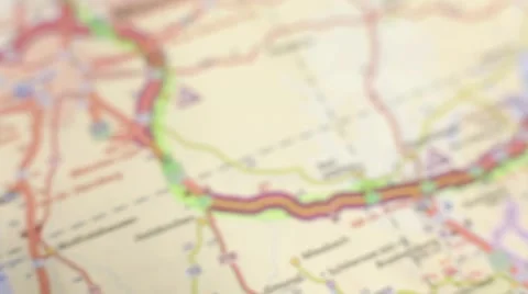 Footage of a road map and a hand holding a compass Stock Footage 43594129