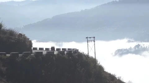 Footage of a road in the mountains with clouds in the background shot in the  Stock Footage 131647984