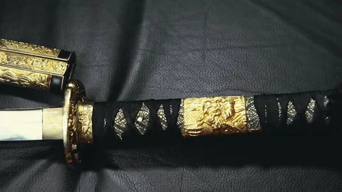 Footage of samurai sword leather background Stock Footage 234871990