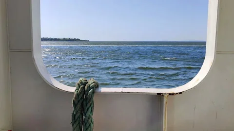 Footage of the Sea from the Deck Window of a Moving Ferry Stock Footage 307884507