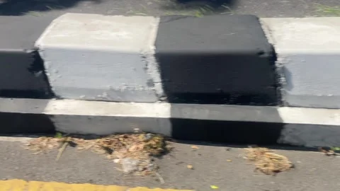 Footage of a separator on a highway that separates 2-wheeled and 4-wheeled Stock Footage 332263818