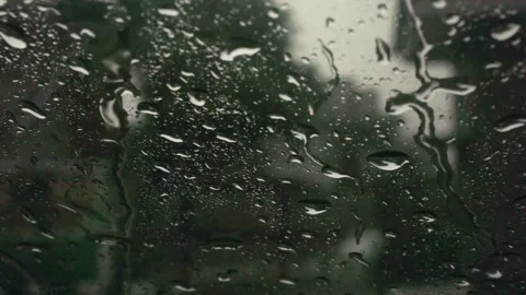 Footage showing raindrops visible through the windshield Stock Footage 254688904