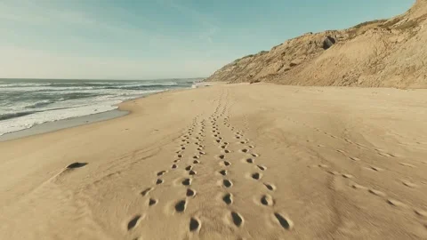 Footage shows footprints on a sandy beach Stock Footage 341827046