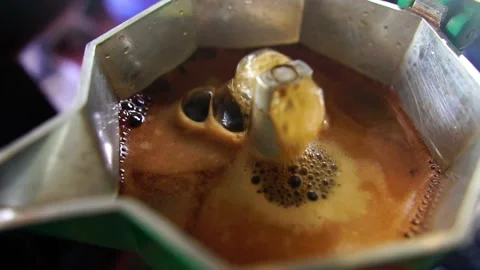 Footage Slow Motion: Boiling coffee in a moka pot Stock Footage 197800060
