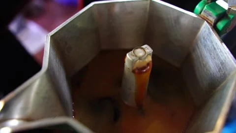 Footage Slow Motion: Boiling coffee in a moka pot Stock Footage 197800186