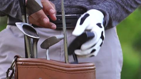 Footage Slow Motion: Man pulling club from golf bag Stock Footage 161893539