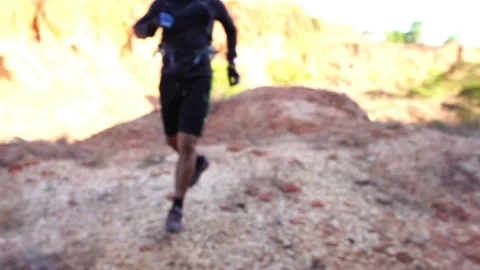 Footage Slow Motion: Man using smart watch during morning run in mountain Stock Footage 146323606
