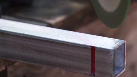 Footage Slow Motion: Man worker grinding iron with electric saw while working Stock Footage 133706551