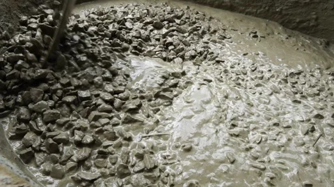 Footage Slow Motion: Mixing cement with sand and stone for use in building work Видео 157627166