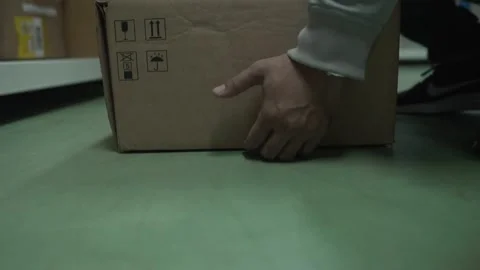 Footage Slow Motion: The parcel staff are holding the cargo box to the shelf Stock Footage 133572291