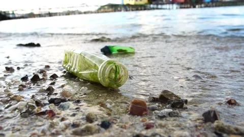 Footage Slow Motion: Pollution on the beach of sea Vídeo Stock 204742554