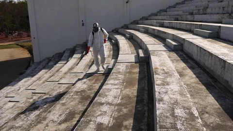 Footage Slow Motion: Specialists in protective suit disinfecting coronavirus 库存影片 148097476