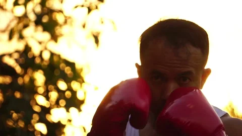 Footage Slow Motion: Strong and muscular boxer training punching with at sunset 스톡 동영상 158995898
