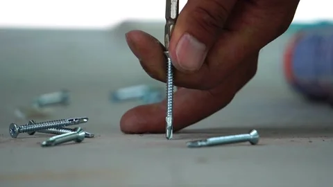 Footage slow motion: Technicians are using screw screwdriver drills to install f Stock Footage 138750611
