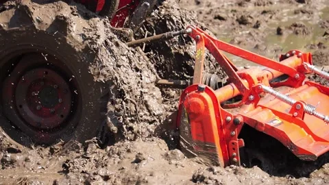 Footage Slow Motion: Tractor plowing field Stock Footage 146720448