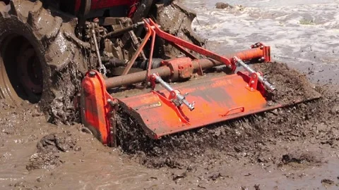 Footage Slow Motion: Tractor plowing field Stock Footage 146720931