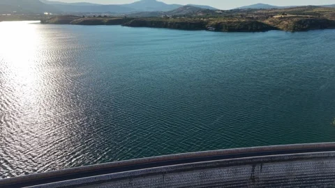Footage of small two small airplanes flying over a lake on a sunny day Stock Footage 343895492