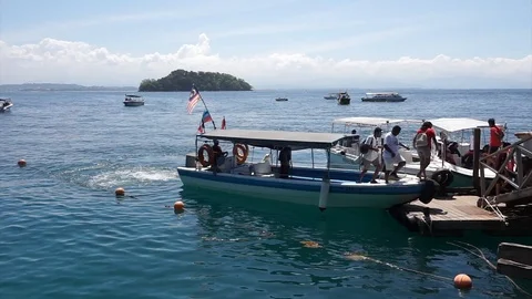 Footage of Speed boat will full of tourist arrive at the most famous island Stock Footage 103267828