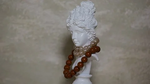 Footage of statue bracelet sharp wall background Stock Footage 149825359