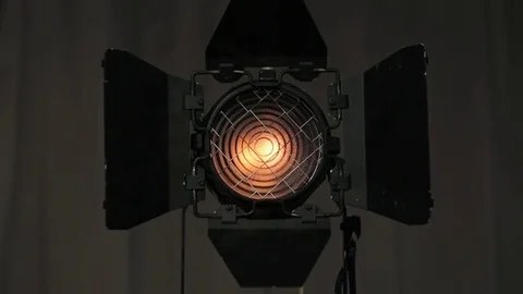 Footage of studio light being turned on and off. Floodlight flashes Video stock 74306974