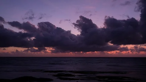 Footage of sun rays emerging through the dark storm clouds background Stock Footage 120781879