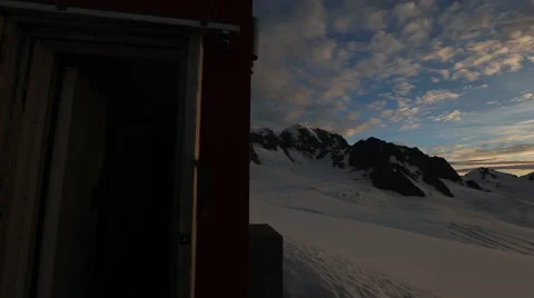 Footage of sunset and clouds over snow covered mountains Video stock 55539365