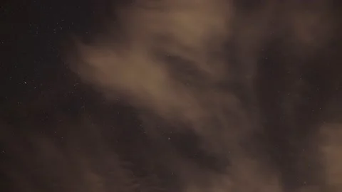 Footage of a time-lapse of a cloudy starry sky, 4K Stock Footage 171978039