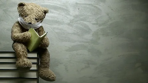 Footage of toy bear book sharp wall Vídeos de archivo 129257316