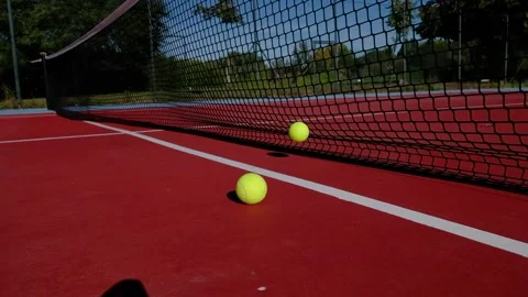 Footage two balls hitting a red tennis court net Stock Footage 162640639