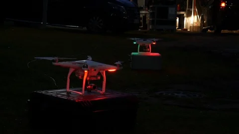 A footage of two DJI Drones (Phantom 4 and Phantom 3 Professional) Stock Footage 99415636