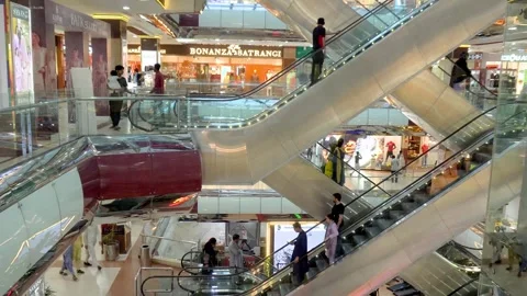 Footage of Unidentified people are using escalators in Shopping mall. Stock Footage 242475307