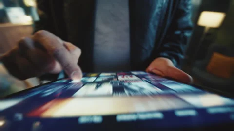 Footage of unrecognizable guy touching screen of digital tablet while looking Stock Footage 238743417