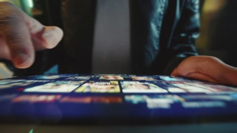 Footage of unrecognizable young man in leather jacket holding digital tablet in Stock Footage 238743561