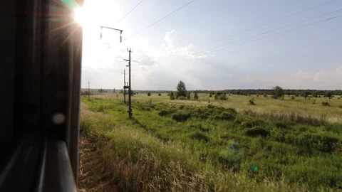 Footage of view through the window of moveing suburban train in summer Vidéo 118042365