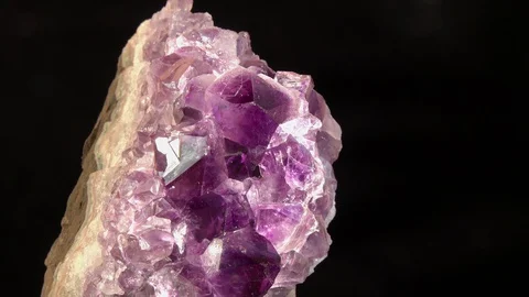 Footage of Violet Crystal Stone macro mineral against a dark background Stock Footage