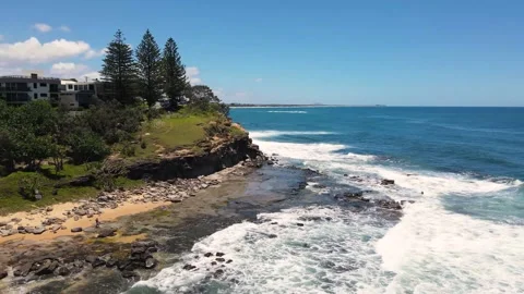 Footage of waves hitting the cliffs at Moffat Beach in Sunshine Coast, Australia Stock Footage 146629405
