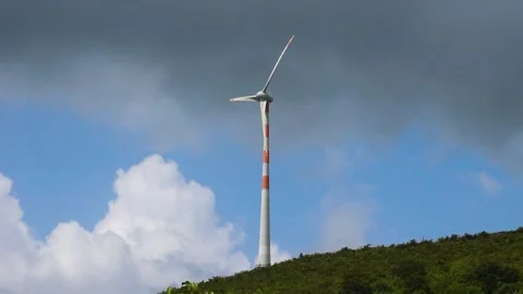 Footage of windmill on top of the hill ,with rotating blades. Stock Footage 211604039