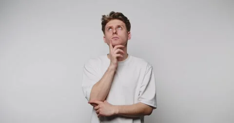 Footage of young contemplative man in thought, exhibiting a pensive express.. Stock Footage 314522437
