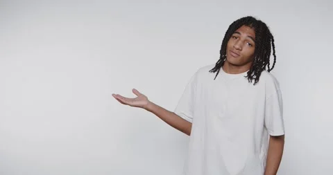 Footage of young man with dreadlocks conveys confusion and uncertainty thro.. Stock Footage 314773083