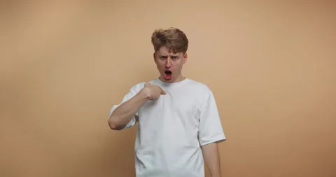 Footage of young man emphasizes his emotions with a pointed finger and an a.. Stock Footage 317631402