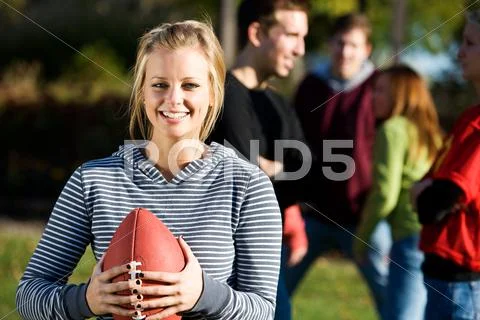Football: cute girl holds football Stock Photos