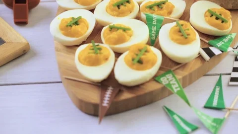 Football deviled eggs for Game day party. Video stock 69794002