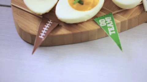 Football deviled eggs for Game day party. Video stock 69794128