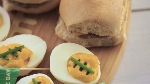 Football deviled eggs for Game day party. Video stock 69794971