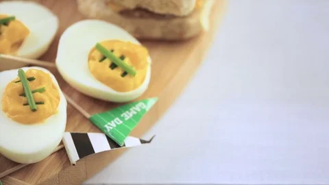 Football deviled eggs for Game day party. Video stock 69795625