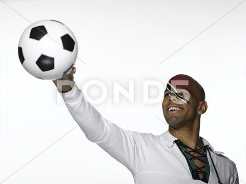 Football fan with Trinidad and Tobago flag painted on face Stock Photos
